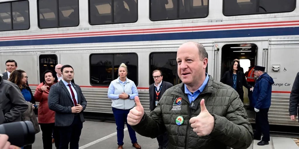 Colorado Governor Jared Polis by an Amtrak special train in Longmont on Mar 7th, 2024. Credit: Longmont Times-Call