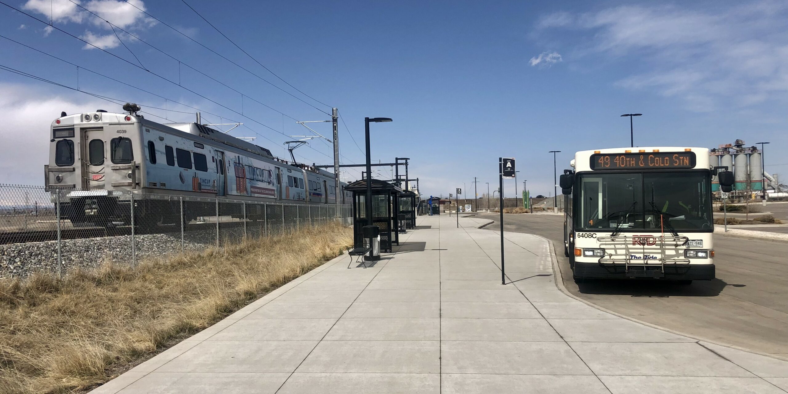 N Line train and 49 bus at Commerce City / 72nd Station.